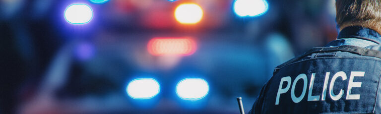 Manhattan 2019. Behind the police with gun belt